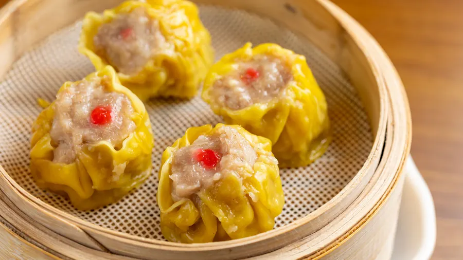 Siu mai in a bamboo steamer at Dumpling Time Block Place