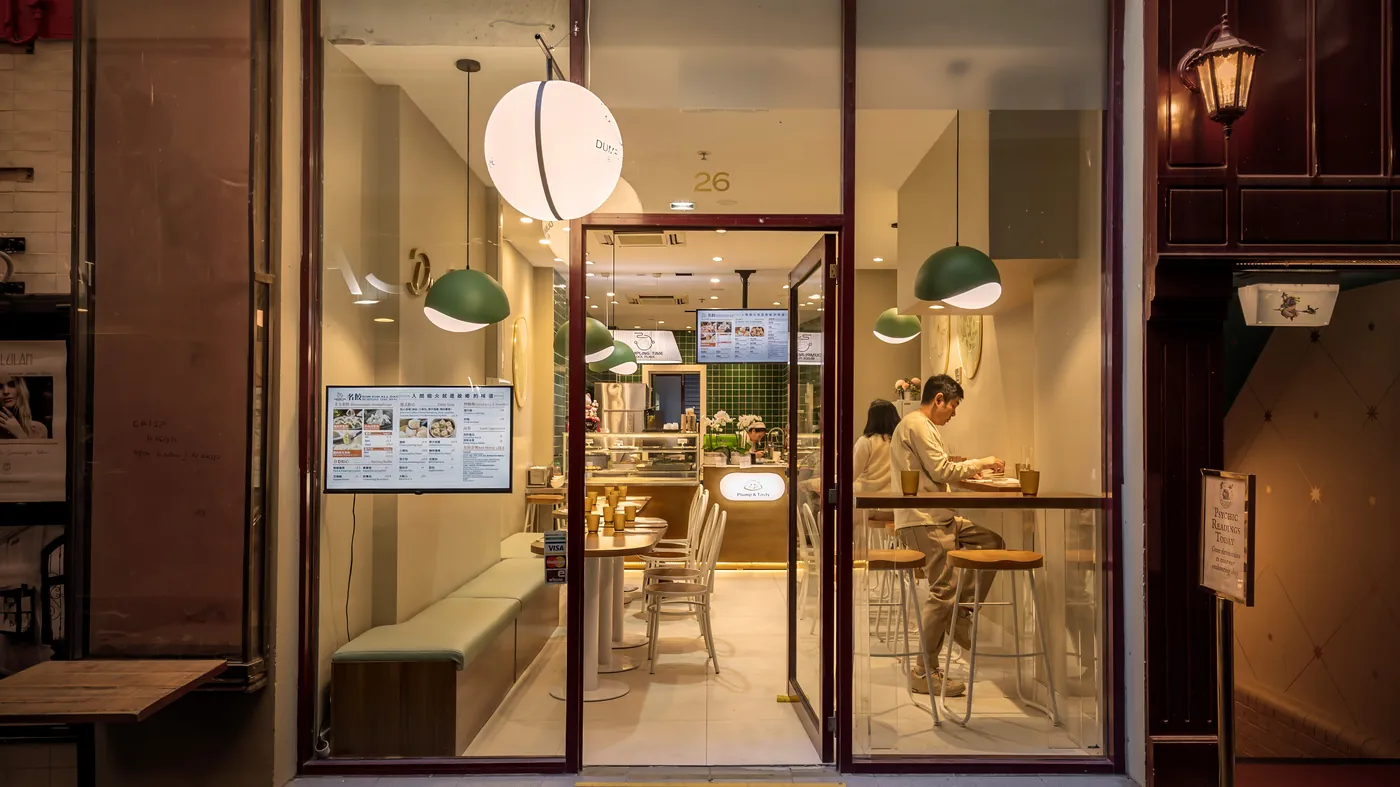 Dumpling Time Block Place storefront and cosy interior on Block Place at night