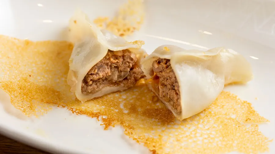 Pan-fried dumpling cut open at Dumpling Time Block Place